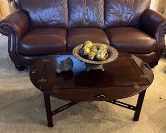 leather sofa and oval/rectangular coffee table