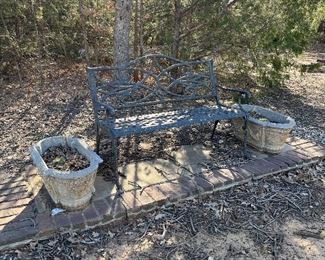 metal park bench and concrete planters