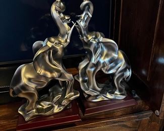polished metal elephant figurines