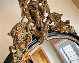 Tall mirror with marble stand and carved detail