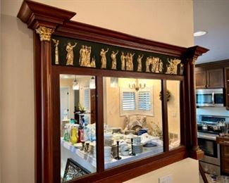 Mirror with carved wood figures
