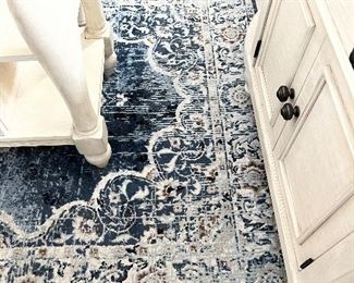 Blue and Tan area rug 5’ x 8’