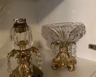 To the left is it antique lighter just a fluid. And to the right is an ashtray tray.