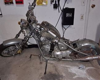 Mini Chopper Transmission has 4 gears, 3 drive, 1 reverse, Hydraulic Brakes, electric start, air suspension and several spare parts