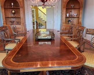 Beautiful inlay pattern dining table. 10'6"L x 4' W as shown with leaves. Missing veneer on end shown on photo.  Will be priced accordingly, but note it is not generally visible.