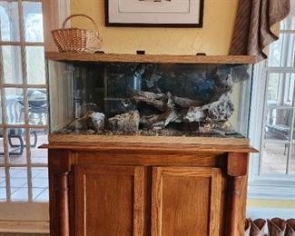 Aquarium (contents) and custom built stand. Fish picture. Lunar phase LED lights.  Can be used for salt or fresh water. Smaller aquarium in base was used for growing coral.