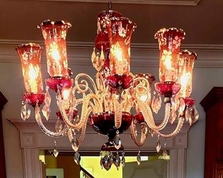 Beautiful Antique Baccarat Crystal 8 arm Chandelier in ruby red  and clear crystal. Original fluted glass hurricane shades feature an exquisite floral motif. Contact for additional photos.