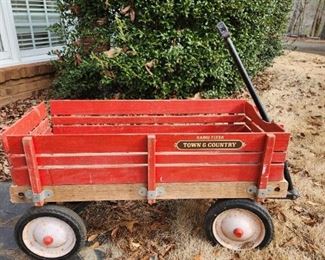 Vintage wooden radio flyer wagon.