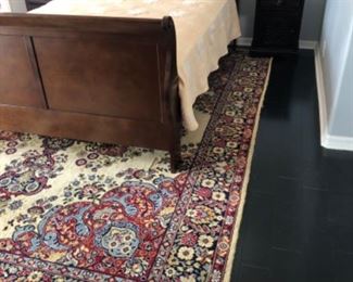 Full sleigh bed with mattress. Area rug