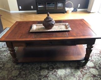 Coffee table, rug, carved bowl with lid
