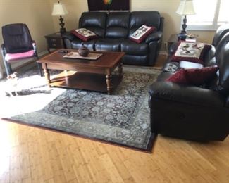 SOLD Leather sofa and loveseat.  Electric reclining loveseat.  Manual release button sofa.  Top condition.  Very dark brown.
