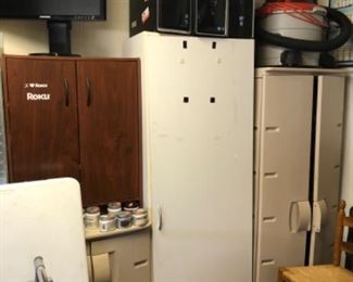 One white storage closet.  One brown storage cabinet.  Two Rubbermaid storage cabinets are sold