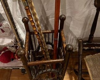 Antique wooden umbrella stand and antique canes