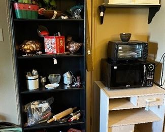 Microwave, toaster oven, cabinets and shelves and misc kitchen items