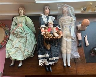 hand-made vintage dolls ( porcelain doll parts - head arms and legs lots more ( bodies were made by the homeowner)