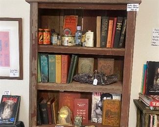 Another old cabinet probably made from barn wood. Pretty cool large amethyst slice, vintage and antique book, a few old bottles & tins. 