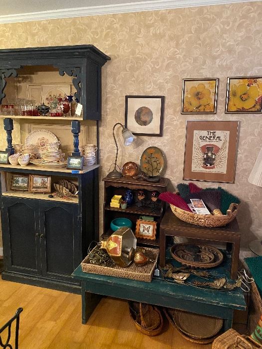 So many amazing treasures… unique blue cabinet made from antique doors - love the character of this piece, a green coffee table also made from antique doors, a swag hanging lamp - Italian Florentine in style, artisanal brooms, 70’s baskets, original floral art , the general silent film art poster beautifully framed