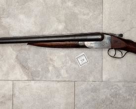 DOUBLE BARREL SHOTGUN MADE BY ITHICA GUN COMPANY IN 12 GAUGE