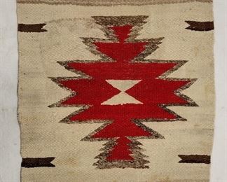 NAVAJO HAND MADE WOOL MAT. 15.5" X 16.75". ONE STAINED AREA. THE RED AREA HAS A SLIGHTLY LESS RED LOOK THAT THE CAMERA FAILED TO CAPTURE