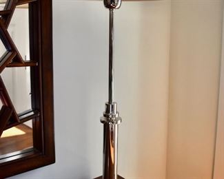One of two silver lamps
