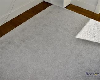 Gray rug measures approx. 9'3” x 11'2”