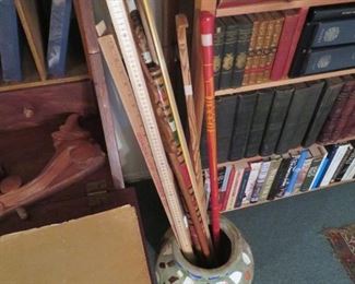 Lots of walking sticks, canes and yardsticks with advertising - and LOTS of chard art