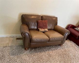 Brown leather love seat 