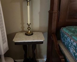 footed mahogany side table with marble top