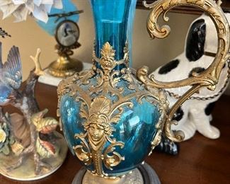ornate blue glass decanter with gold trim handle