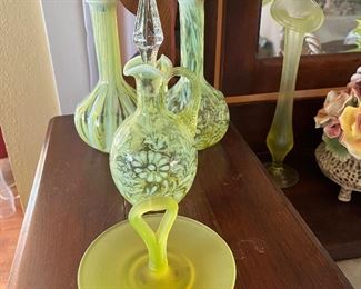 Vaseline glass decanter, vases