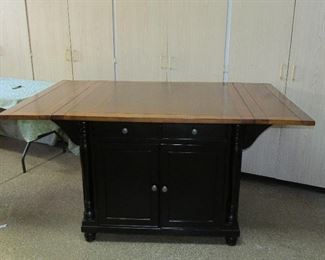 Large table/island cabinet with drop downs, storage and two matching chairs (not shown)
