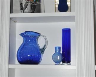 Stunning Selection of Cobalt Blue Glassware Including Mugs and Water Pitcher Made in Mexico as well as a Fantastic Jonathan Adler Bel Air Cobalt Mini Scoop Vase.