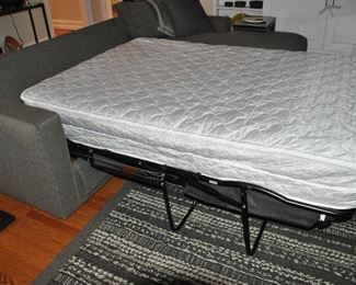 View of the Air Coil Air Mattress Inflated in the  ARHAUS Sofa