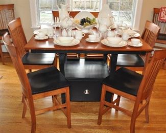 "Larkin" Gathering Table by L.J. Gascho Furniture with 8 Counter Height Chairs part of the Amish Craftsmen Collection. The dining table measures 54" x 42" and opens up to 66" with the 2-12" leaves.