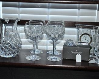 Waterford "Lismore" Crystal Pitcher Shown with a Set of 4 Waterford "Love" Balloon Wine Glasses, a Waterford "Atrium" 7" Desk Clock, a NIB Waterford Crystal Bottle Stopper,and a Vintage Waterford "Lismore" Sugar Shaker