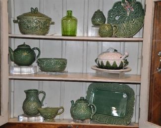 Vintage Pantry opens to Wooden Shelves Displaying Many Bordallo Pinheiro Earthenware Serving Pieces, a Vintage Green Glass Vase and a Fabulous Majolica Cauliflower Soup Tureen