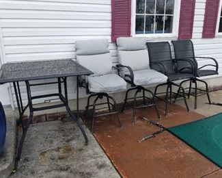 Bar height patio table and four chairs