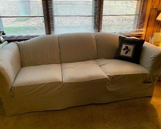 	#19	Sofa with slip cover. Matches loveseat. 88L	 $30.00 				