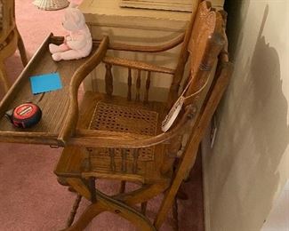 ANTIQUE OAK PRESSED BACK HIGH CHAIR WITH WHEEL S