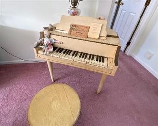 THE CUTEST PIANO ! ITS A BABY GRAND FOR CHILDREN.. KEYS WORK PRETTY WELL, APPROX. 3' ACROSS AND ABOUT 42 INCHES LONG... STAND ABOUT 27" HIGH 