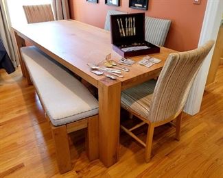 Crate & Barrel Sobro 86" Oak Dining Table with six chairs and a bench