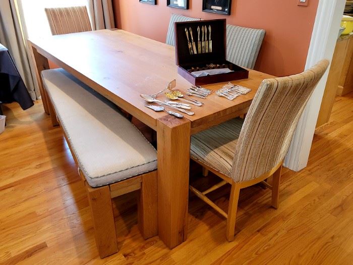 Crate & Barrel Sobro 86" Oak Dining Table with six chairs and a bench