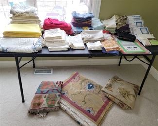 Table linens. Vintage embroidered pillow cases. Rugs