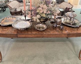 Another dining table; silverplate serving pieces; floral arrangement