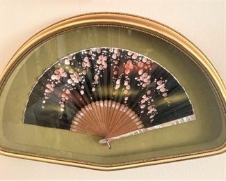One of two framed Asian fans