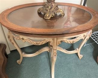 Small oval wood and glass coffee table