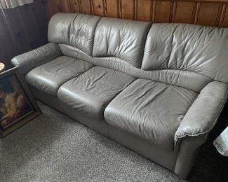 Grey leather sofa and loveseat