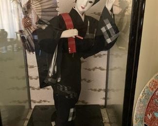 Japanese doll in glass case