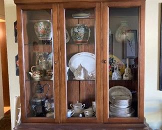 China cabinet with tea sets, china dishes, vases, bells