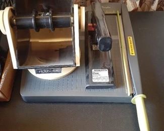 Office supplies. Rolodex, large stapler, and Swingline papercutter